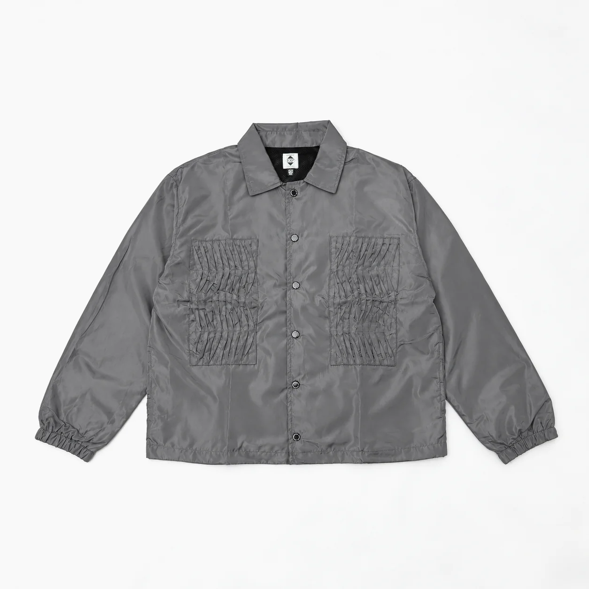 EXPANSION NY 2026AW EP HACKING JACKETのグレーの正面。ハッキングジャケットを思わせるフロントポケットを備えたボックスシルエットのコーチジャケット。