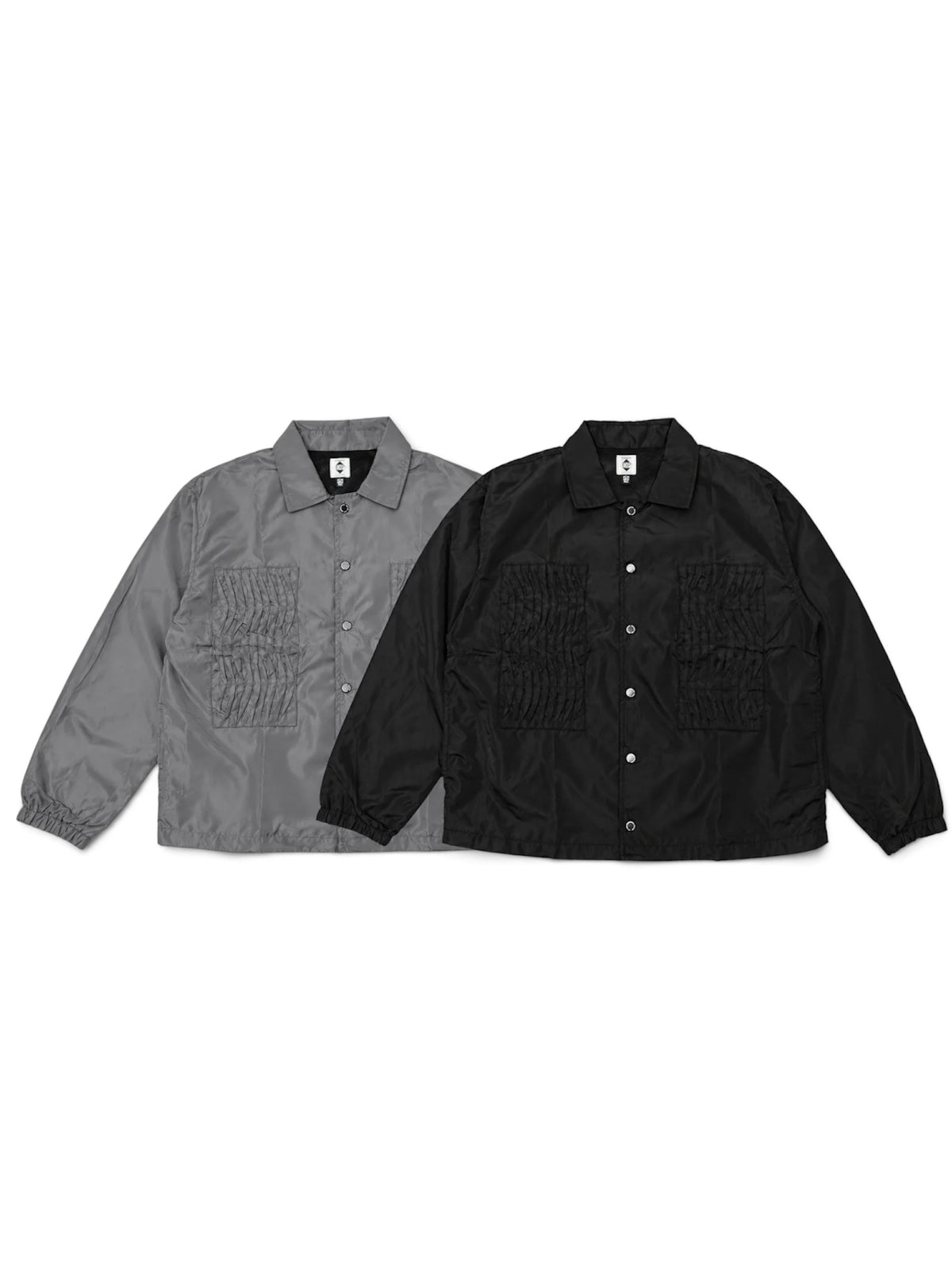 EXPANSION NY 2026AW EP HACKING JACKETのブラック・グレーの正面。ハッキングジャケットを思わせるフロントポケットを備えたボックスシルエットのコーチジャケット。